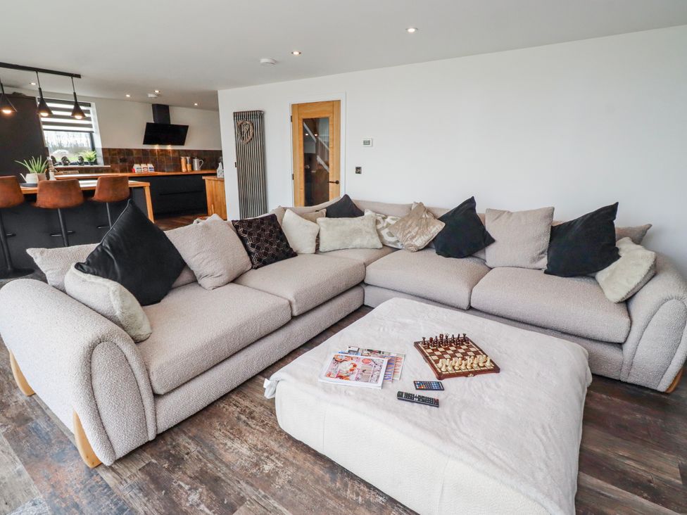 A living room with a sofa and coffee table at The Joiners Cottage in Birling near Warkworth