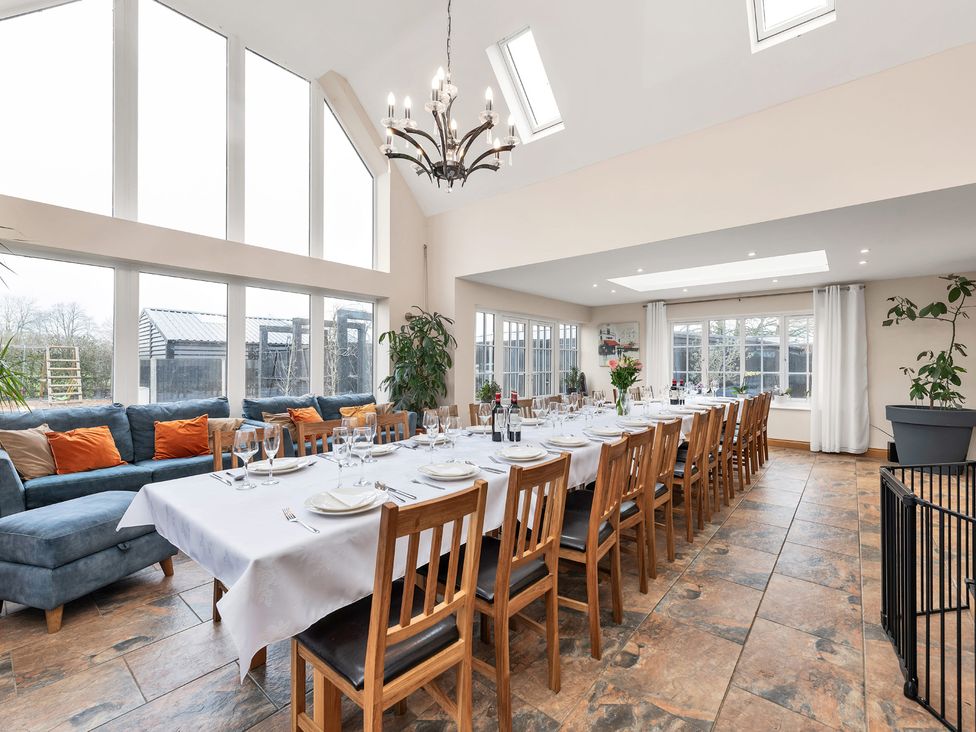 A dining room with a large table and chairs at Oldfields in 