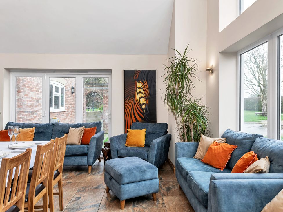 A living room with sofas and a table at Oldfields