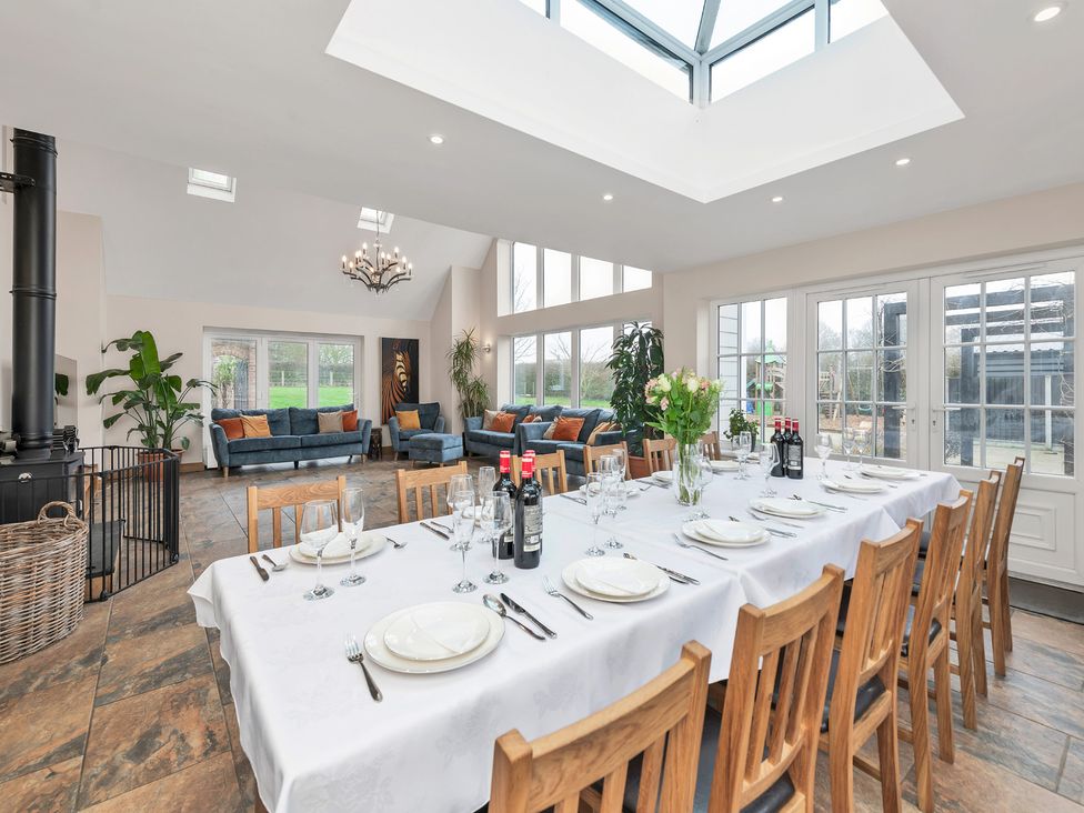 A dining room with a large table and chairs at Oldfields