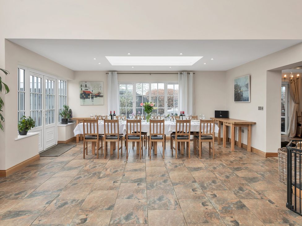 A dining room with a large table and chairs at Oldfields