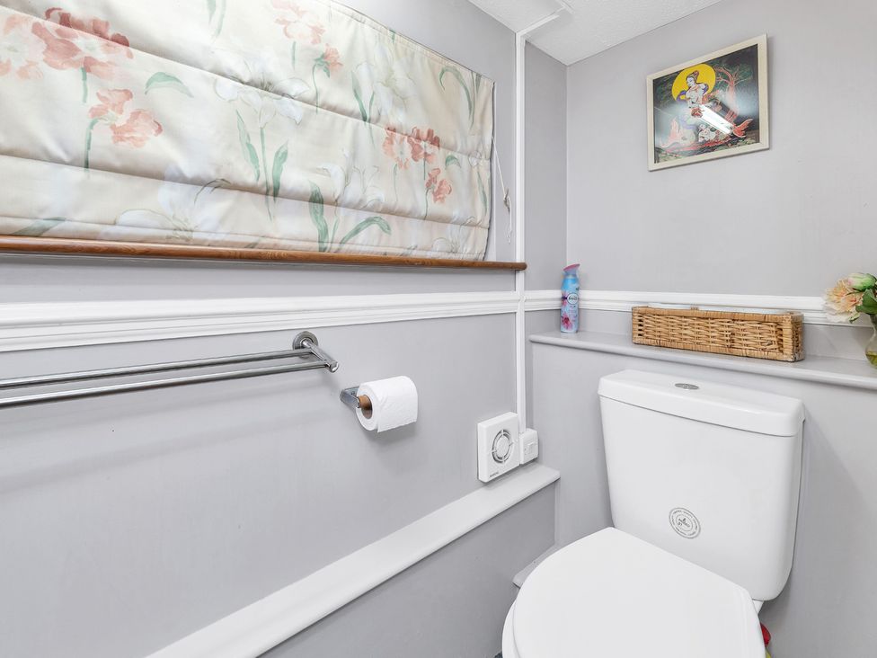 A bathroom with a toilet and a towel rack at Oldfields
