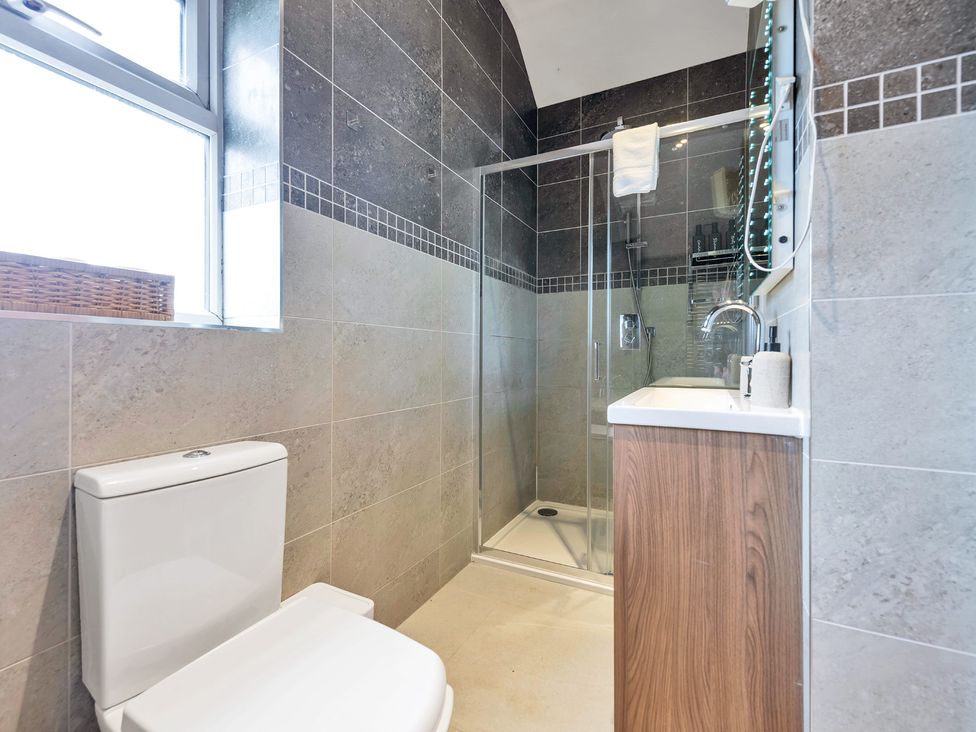 A bathroom with a shower and toilet at Oldfields