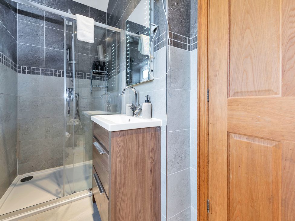 A bathroom with a shower and sink at Oldfields