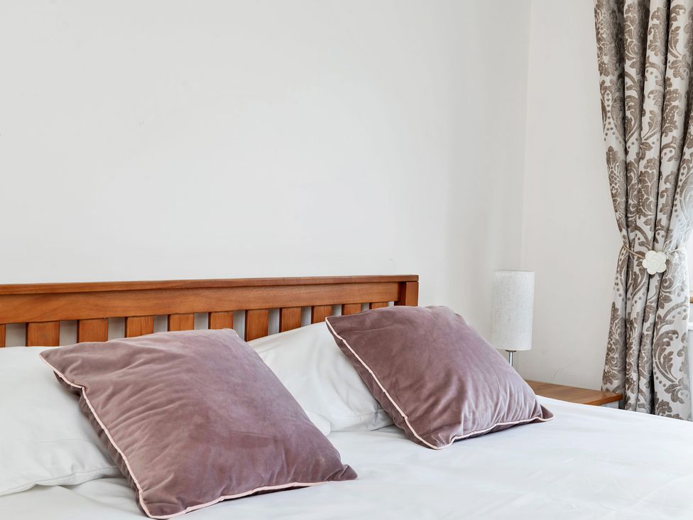 A bedroom with a bed and pillows at Oldfields