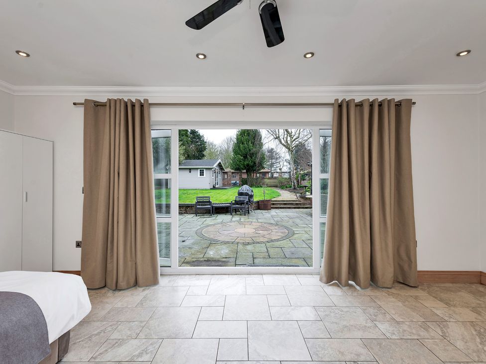 A room with sliding doors leading to the garden at Oldfields