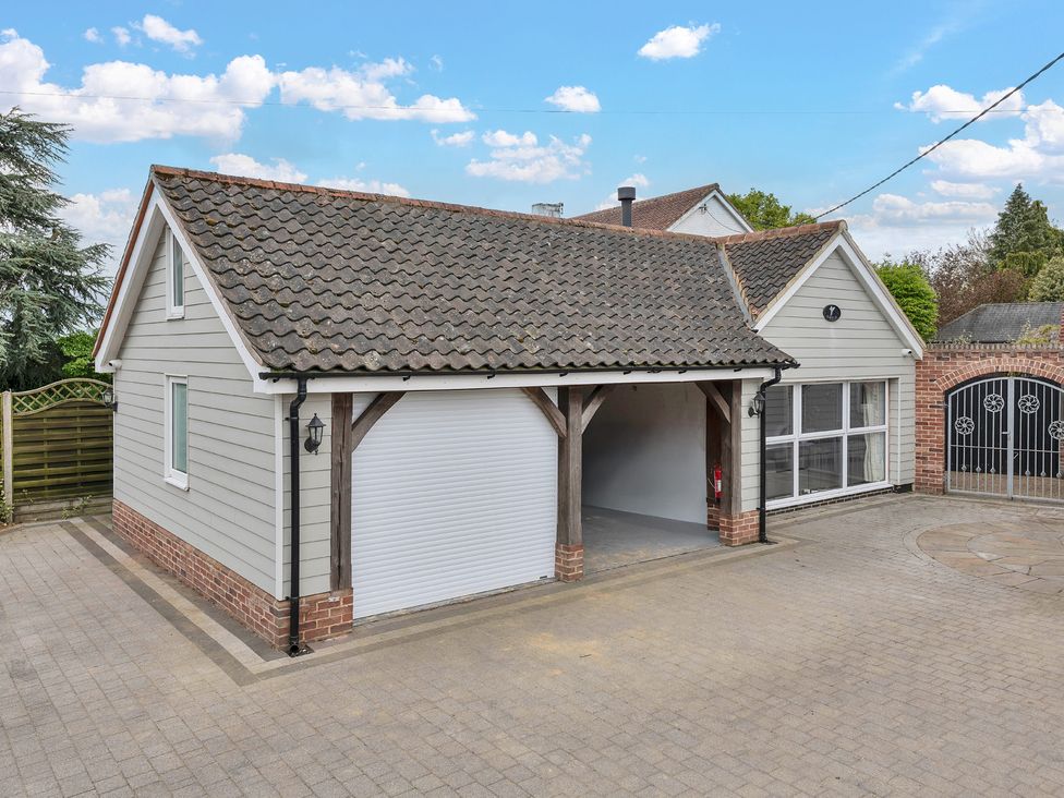 A garage with a door and window at Oldfields
