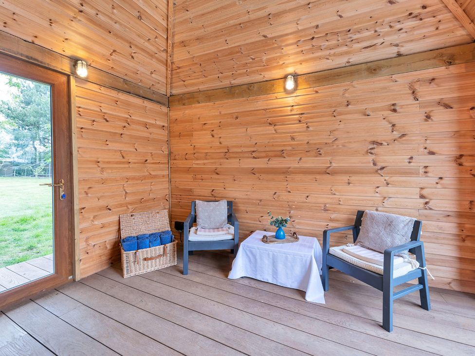 A seating area with two chairs and a table at Oldfields
