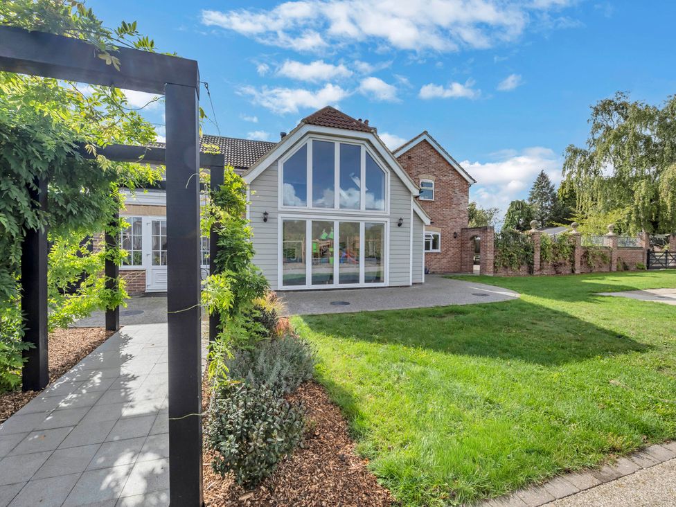 An exterior view of a house with a pathway and garden at Oldfields in Bury St Edmunds