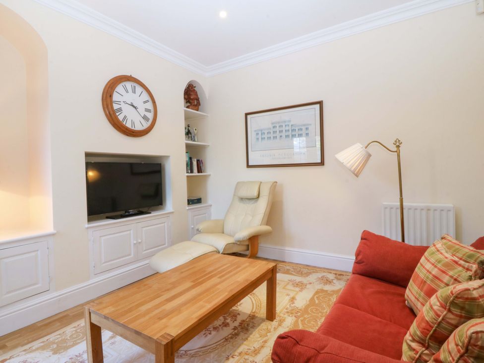 A living room with a sofa and coffee table at Bryniau in Morfa Nefyn