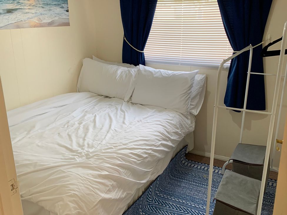 A bedroom with a bed and window at 187 Atlantic Bays Tregolds