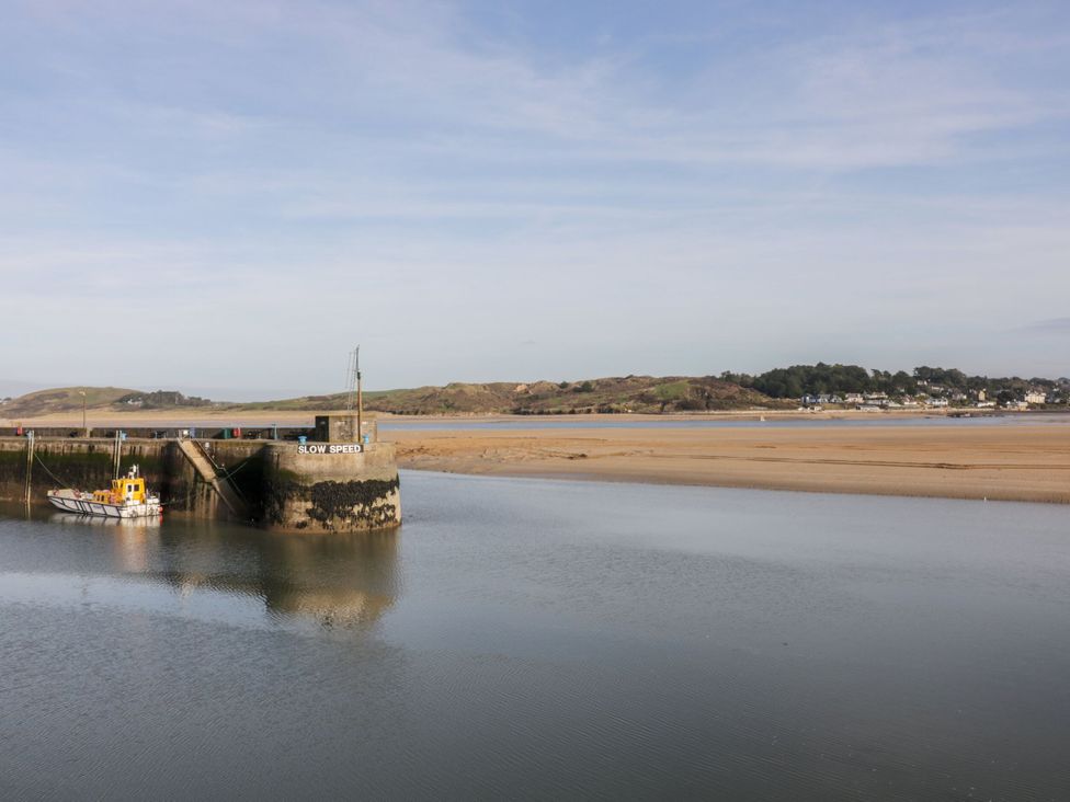 A harbor with a boat and a sign at 187 Atlantic Bays Padstow