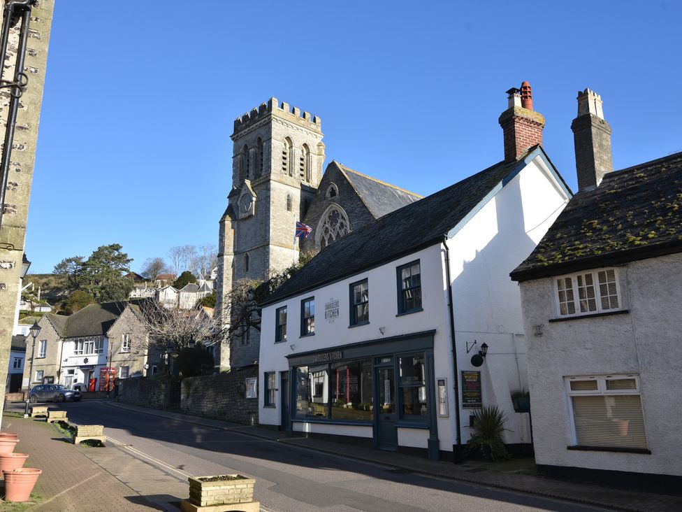 A street view featuring a church and buildings at Devona in Beer