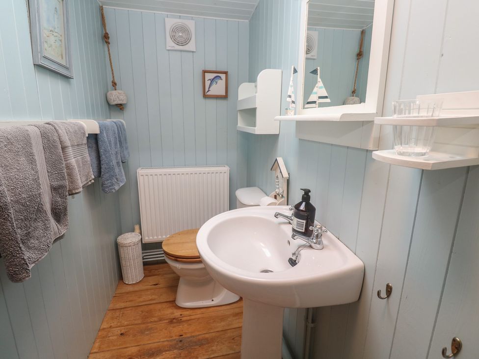 A bathroom with a sink and toilet at Pleasans in Hayle