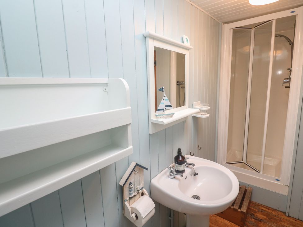 A bathroom with a sink and shower at Pleasans in Hayle