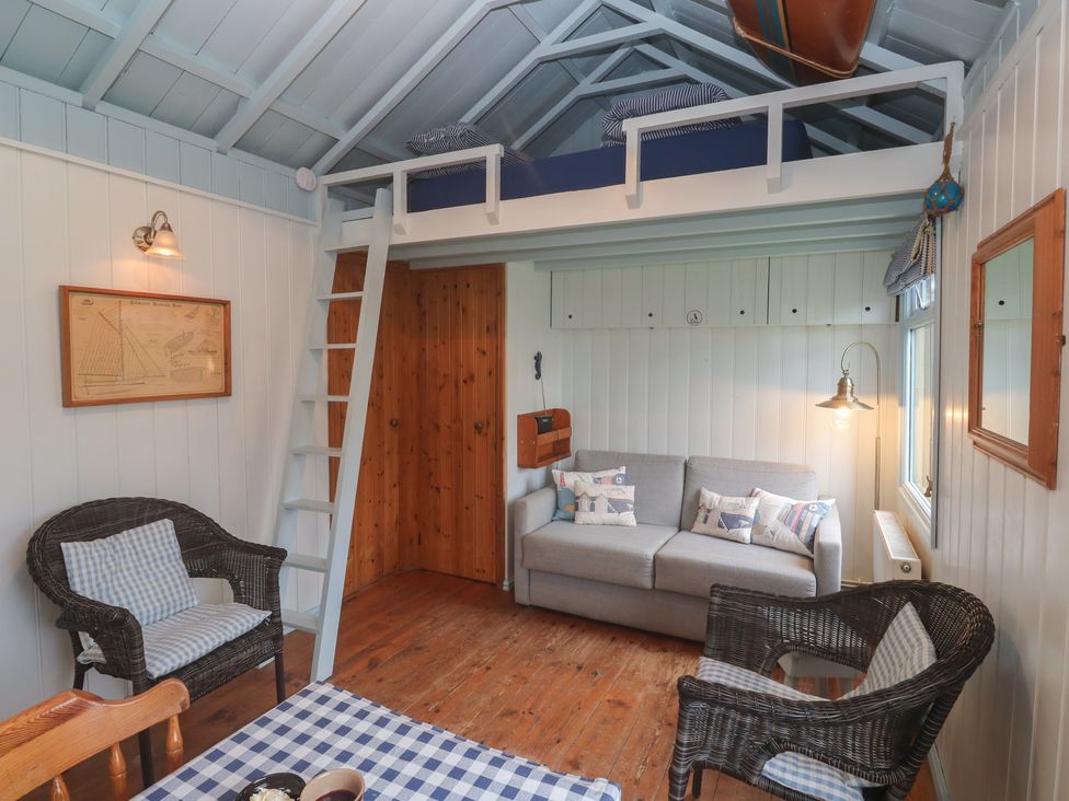A living room with sofa and armchairs at Pleasans in Hayle