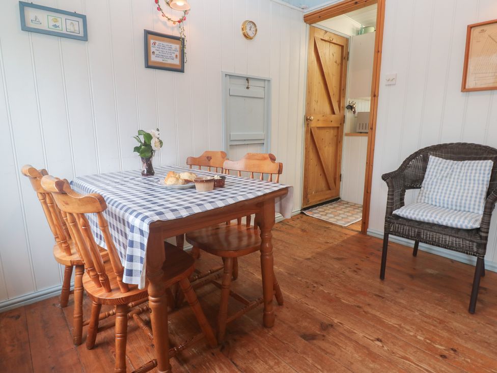 A dining room with a table and chairs at Pleasans in Hayle