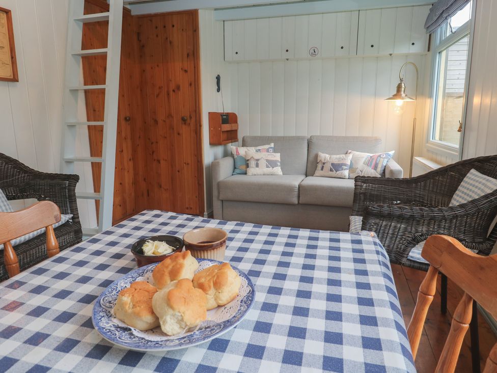 A living room with scones on a table at Pleasans in Hayle