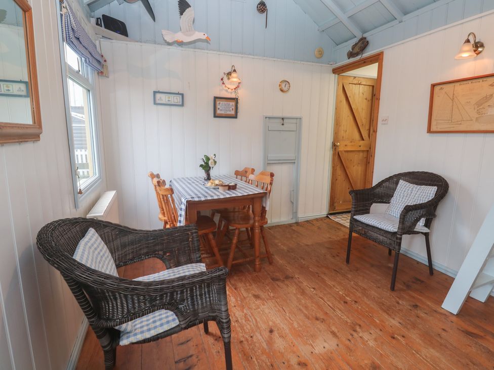 A dining room with a table and chairs at Pleasans in Hayle