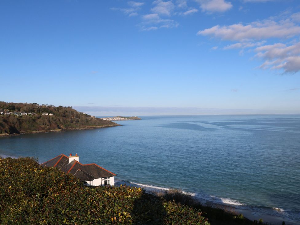 A view of the ocean and beach with a house in the foreground at Pleasans, Hayle