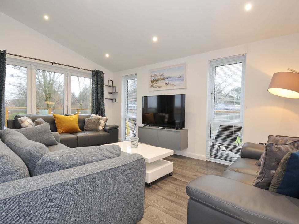 A living room with a sofa and television at 20 Meadow Retreat in Dobwalls