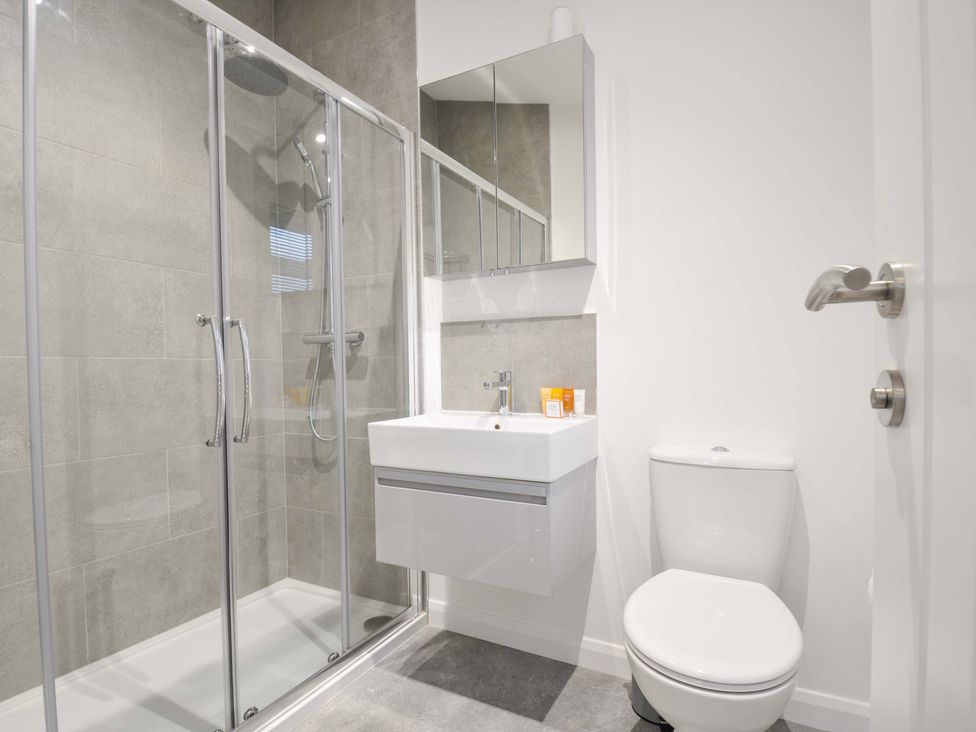 A bathroom with shower, toilet, and sink at 20 Meadow Retreat in Dobwalls