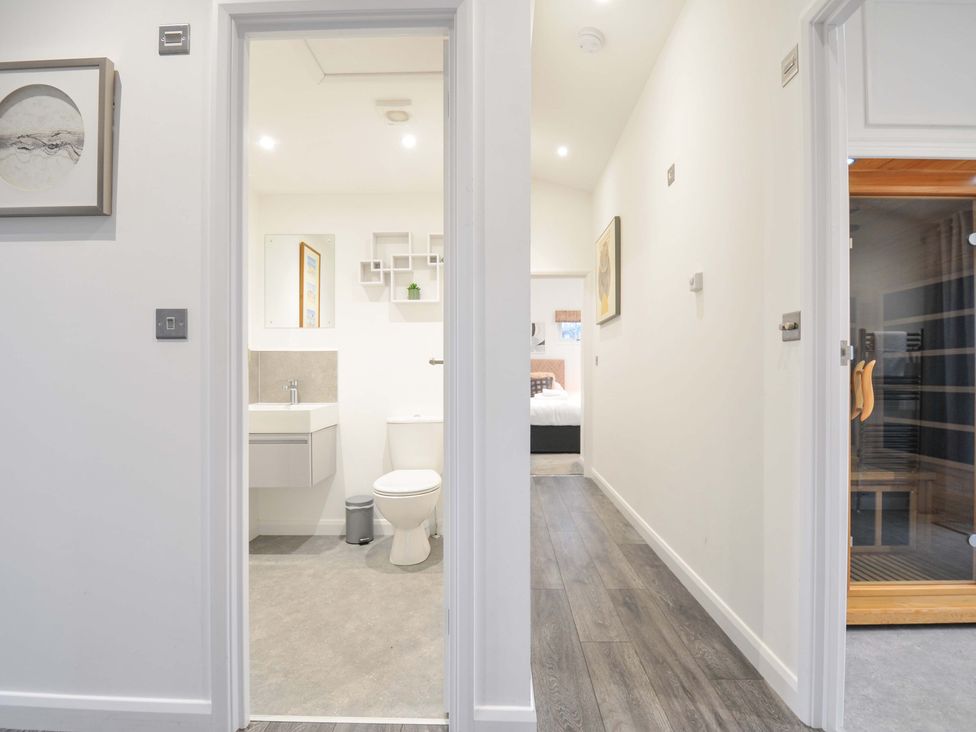 A hallway with a bathroom and bedroom view at 20 Meadow Retreat in Dobwalls