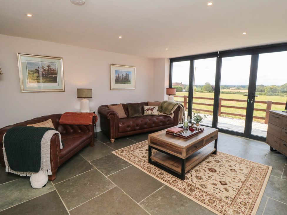 A living room with a sofa and coffee table at Westholme Lodge in Thirsk