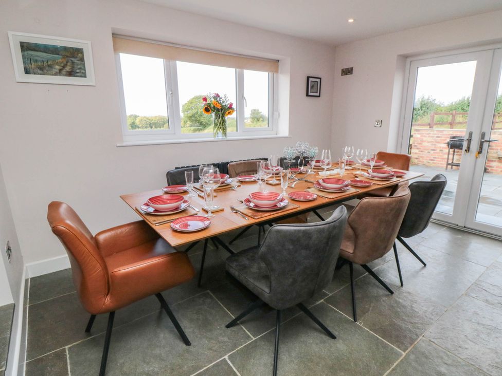 A dining room with a set table at Westholme Lodge Thirsk