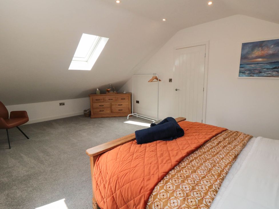 A bedroom with a bed and drawer unit at Westholme Lodge in Thirsk