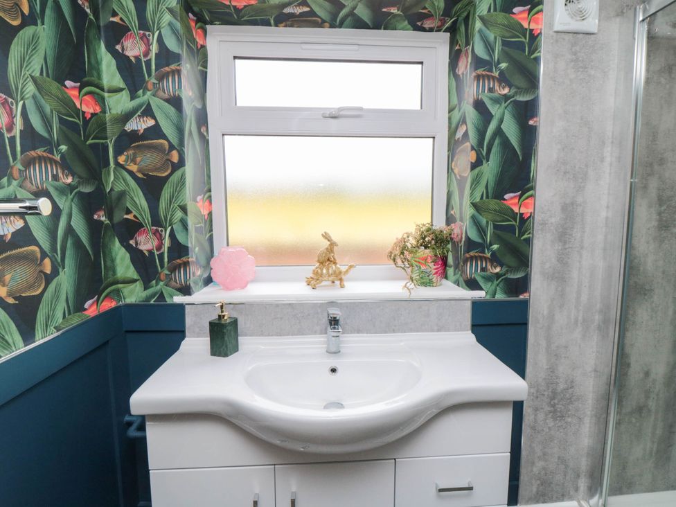 A bathroom with a sink and window at Westholme Lodge Thirsk