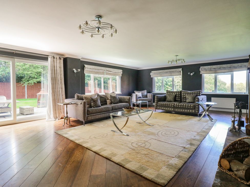 A living room with sofas and a coffee table at Panel Place near Pett