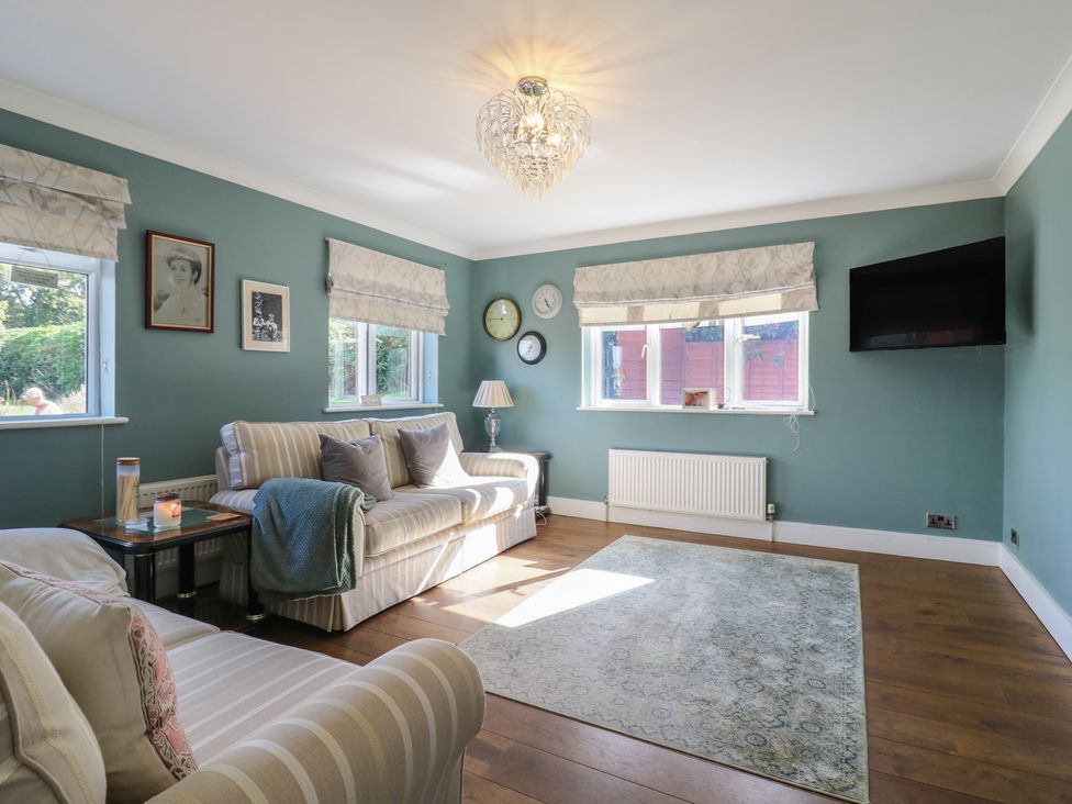A living room with a sofa and coffee table at Panel Place near Pett