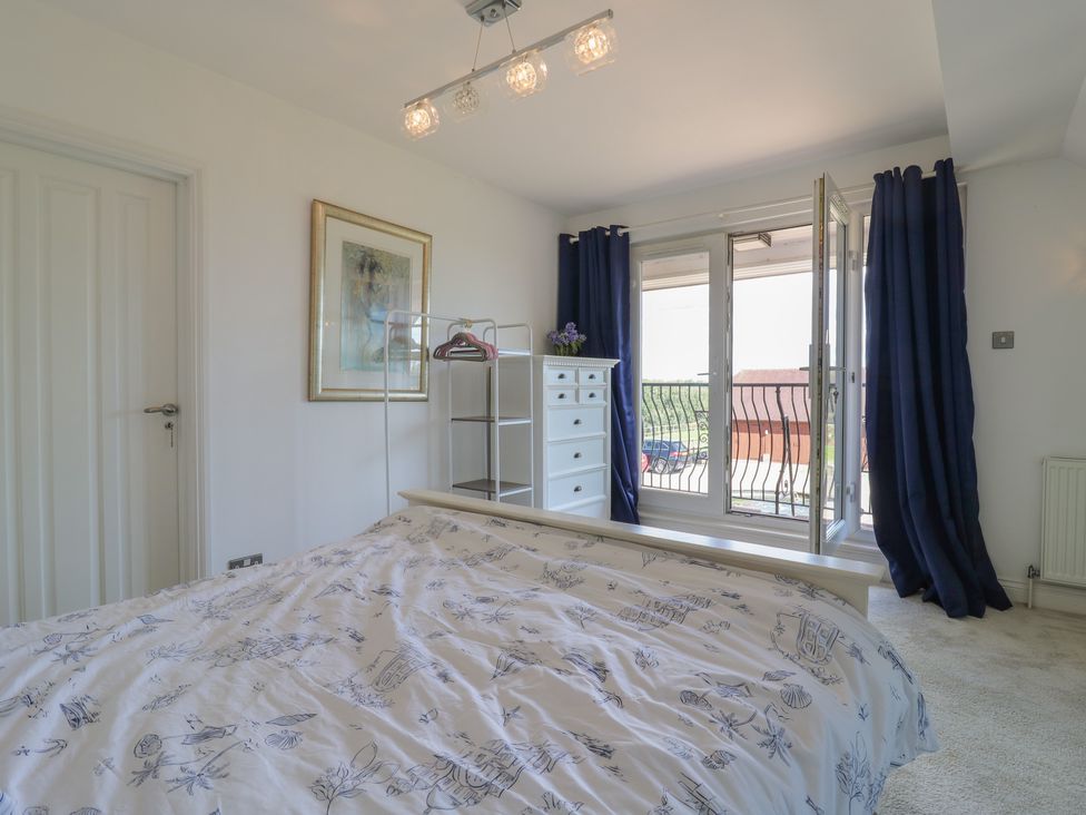 A bedroom with a bed and a window at Panel Place near Pett