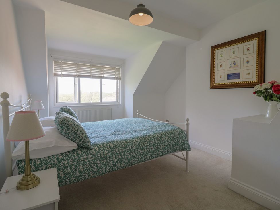 A bedroom with a bed and a window at Panel Place near Pett