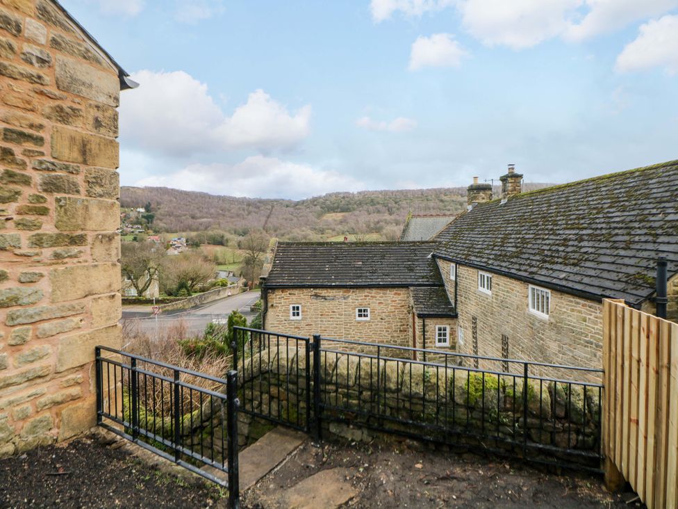 An outdoor view of houses and mountains from a property at The Reading Room in Hope Valley