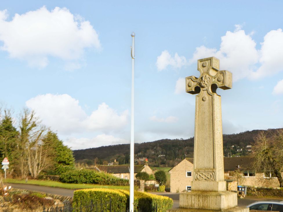 A cross and flagpole near buildings in Hope Valley