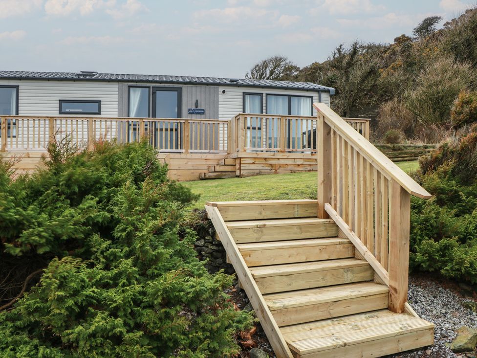 An exterior view of a property with steps and decking at Willow's Way in Stranraer