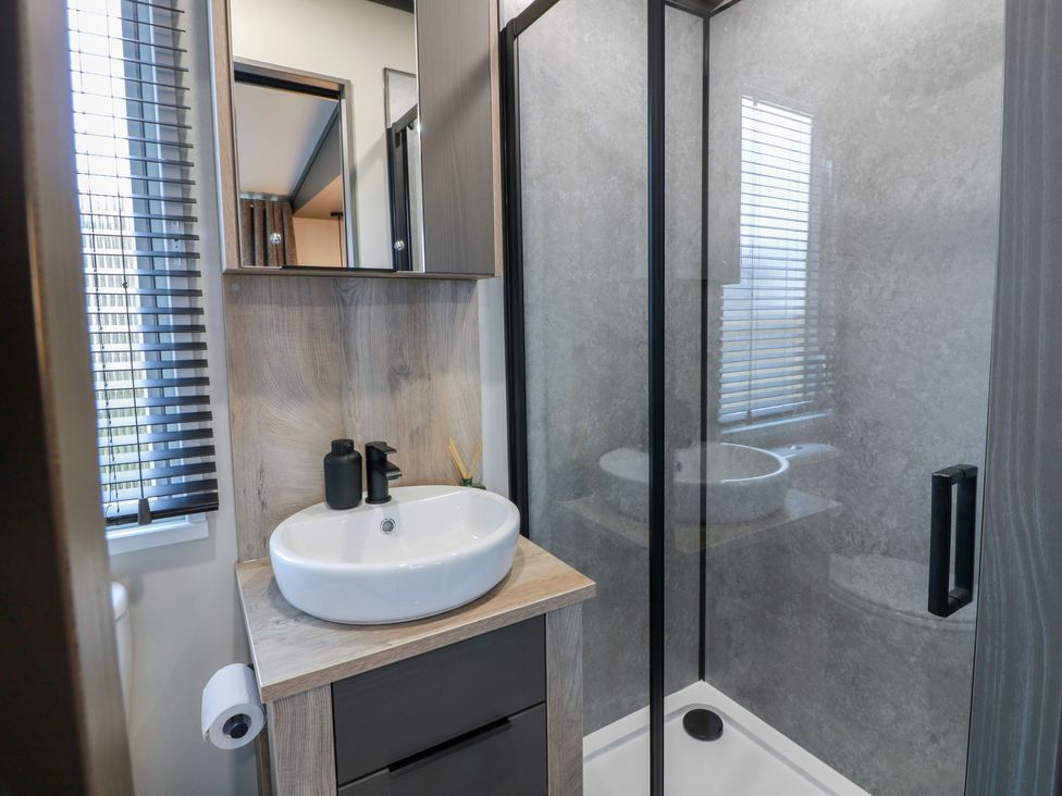 A bathroom with a sink and a shower at Willow's Way in Stranraer