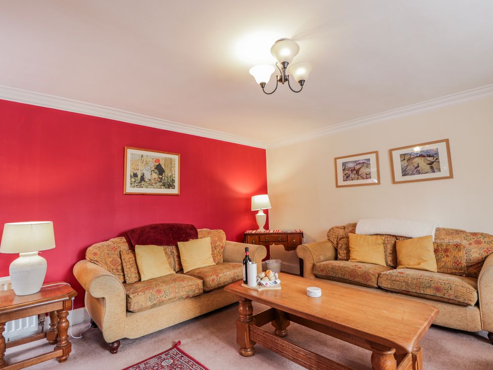 A living room with a sofa and coffee table at Achnagonlin House in Grantown-on-Spey