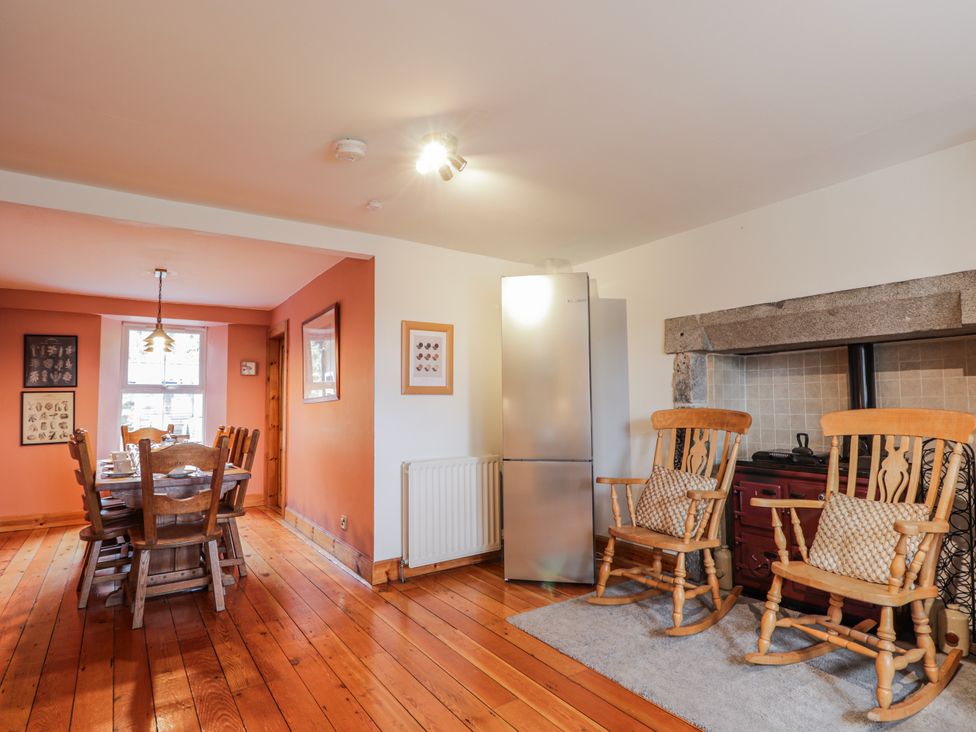 A dining room with a table and chairs at Achnagonlin House in Grantown-on-Spey
