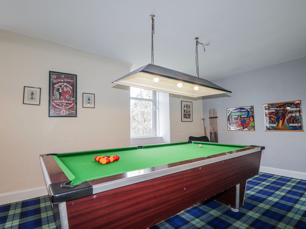 A games room with a pool table and wall art at Achnagonlin House in Grantown-on-Spey
