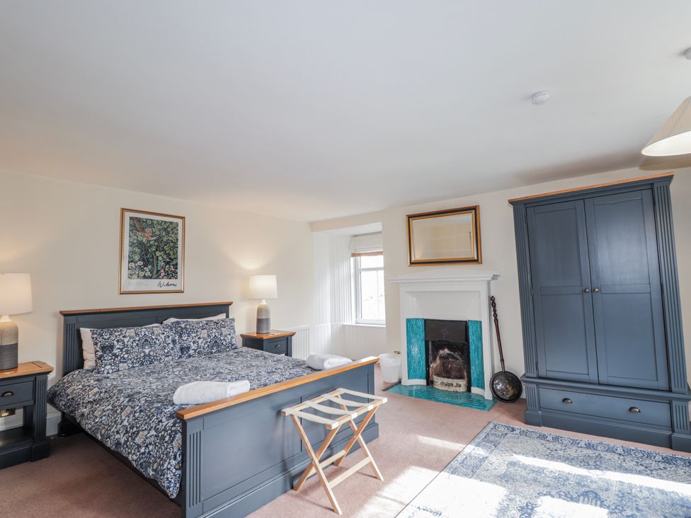 A bedroom with a bed and furniture in Achnagonlin House Grantown-on-Spey