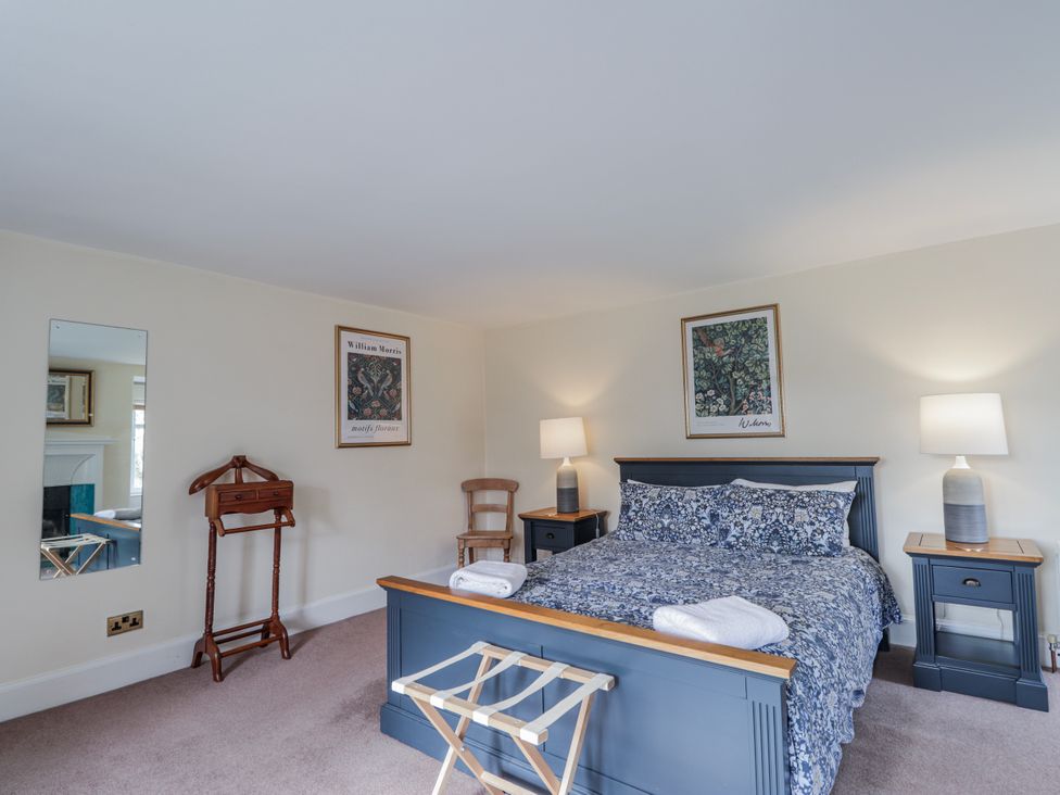 A bedroom with a bed and furniture at Achnagonlin House in Grantown-on-Spey