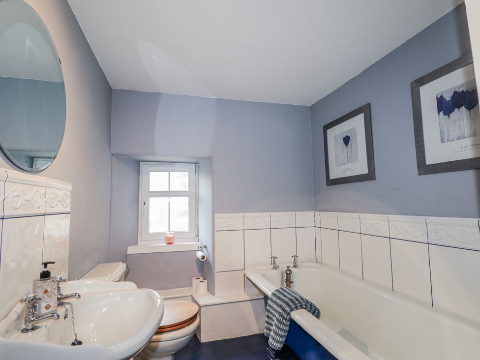 A bathroom with a sink, toilet, and bathtub at Achnagonlin House in Grantown-on-Spey