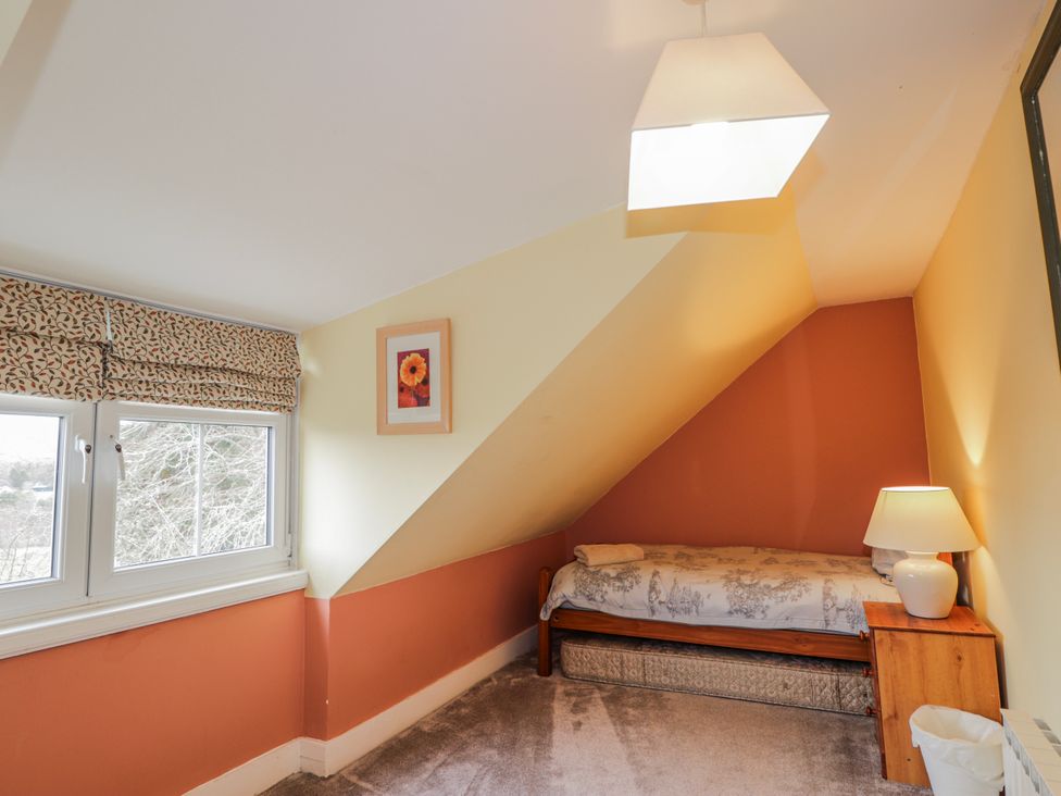 A bedroom with a single bed and a window at Achnagonlin House in Grantown-on-Spey