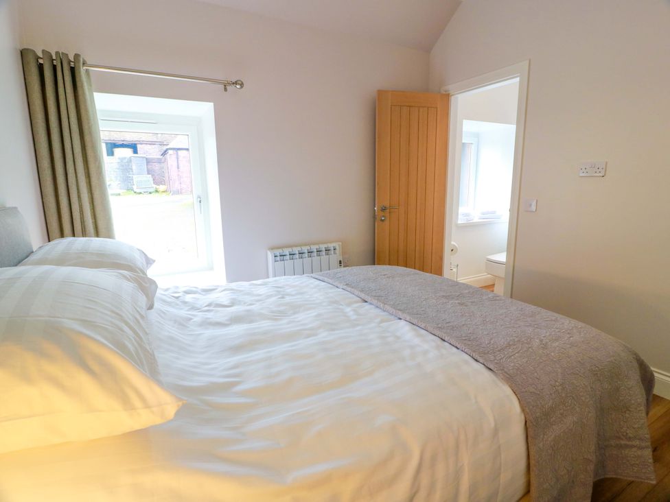 A bedroom with a bed and window at Burnside Bothy Burnside Farm near Girvan