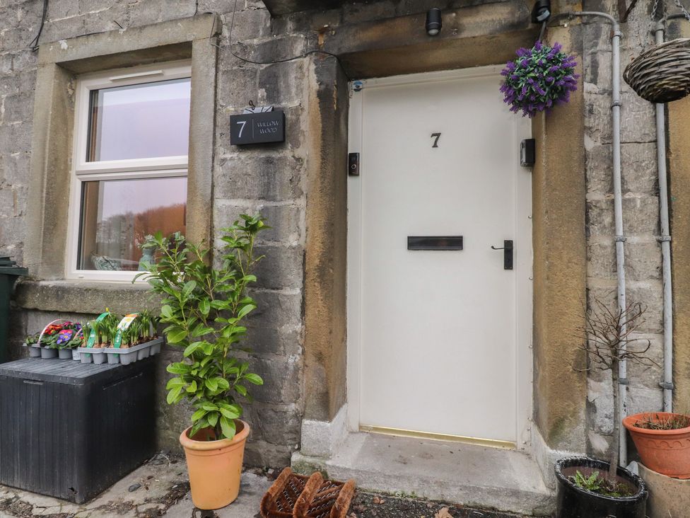 An entrance with a door and plants at Willow Wood in Settle