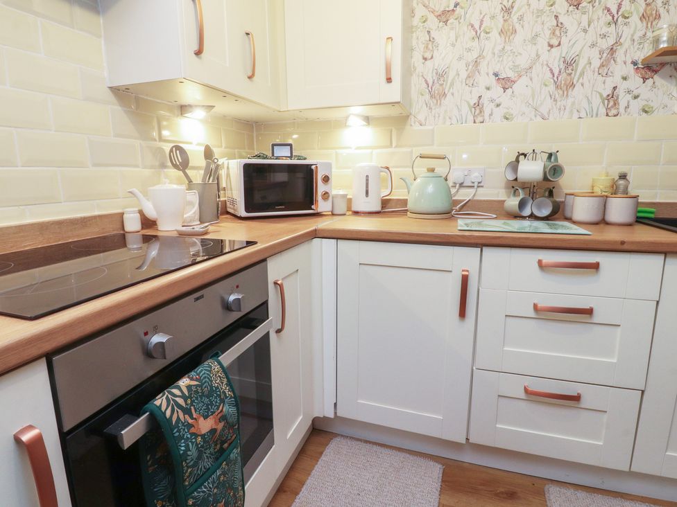A kitchen with appliances and utensils at Willow Wood in Settle