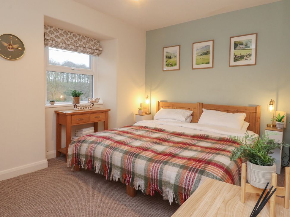 A bedroom with a bed and window at Willow Wood in Settle